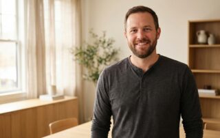 Confident man representing normal size men seeking body confidence solutions in modern wellness setting