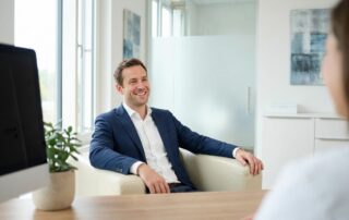 Confident man in professional medical consultation room discussing best size of panis concerns