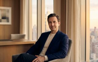 Confident man in modern medical consultation room representing reversible penis enlargement options with HA fillers